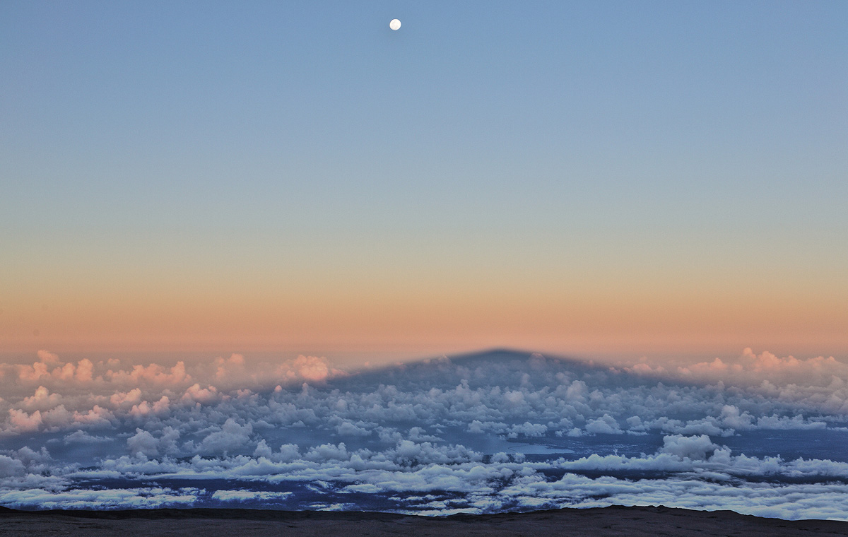 Moon, Mauna Kea shadow, Hilo through clouds
