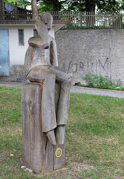 A carving of a beer drinker
